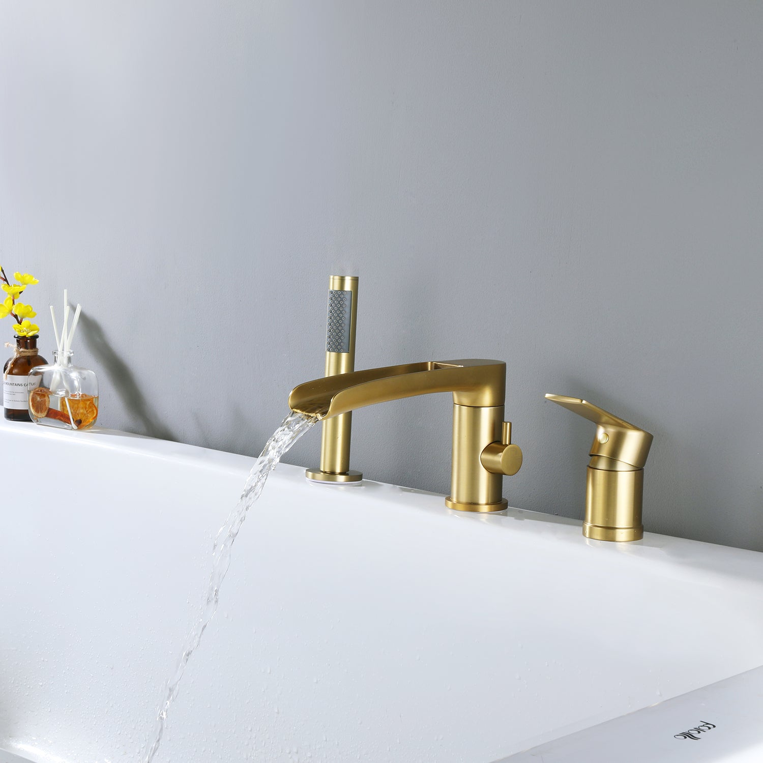 Deck-Mounted Roman Tub Faucet with Waterfall Spout and Handheld Shower