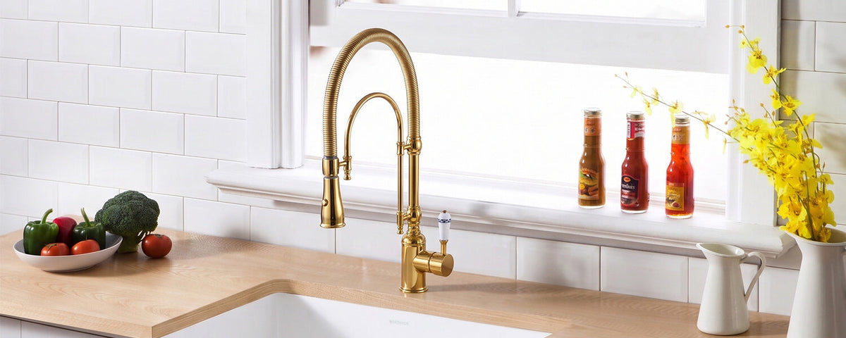modern kitchen with gold faucet on wood countertop near window with white tile backsplash