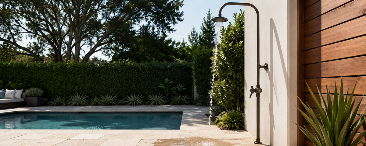 Outdoor shower with low water pressure beside a modern backyard pool