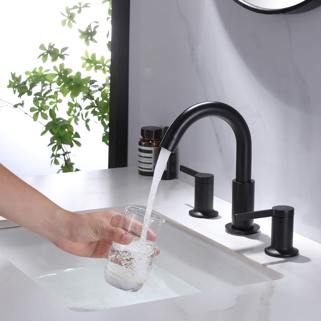 black widespread faucet filling water