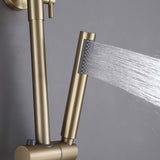 Gold handheld shower sprayer with water flow, part of a modern outdoor shower system