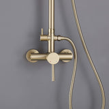 Close-up of gold-finish shower mixer valve with water control and handheld sprayer attachment