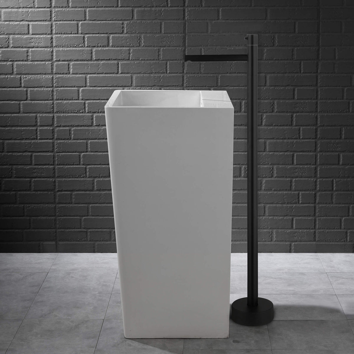 floor standing bathroom faucet beside basin