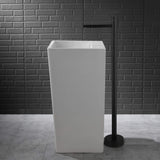 floor standing bathroom faucet beside basin