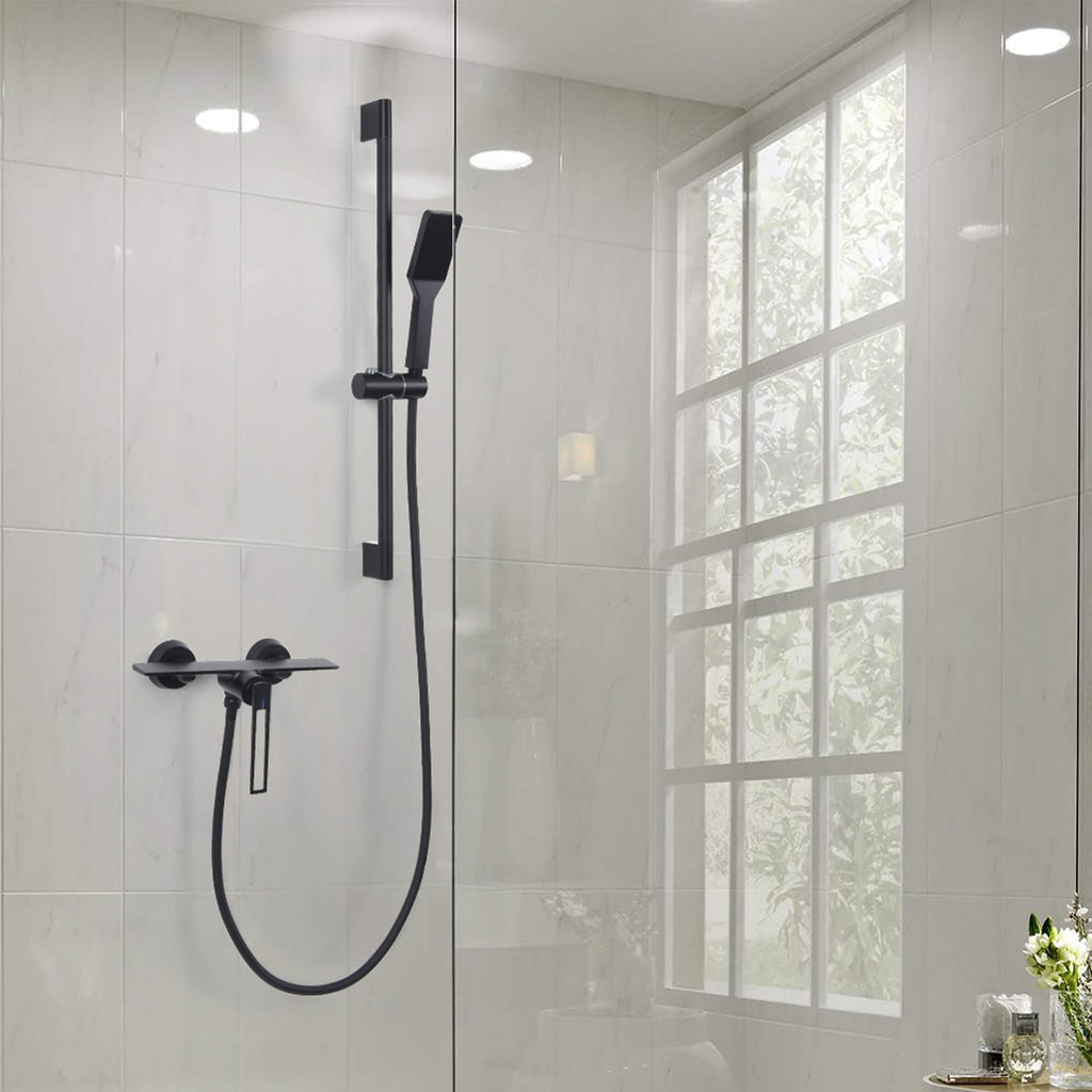 black shower faucet in freestanding bathroom