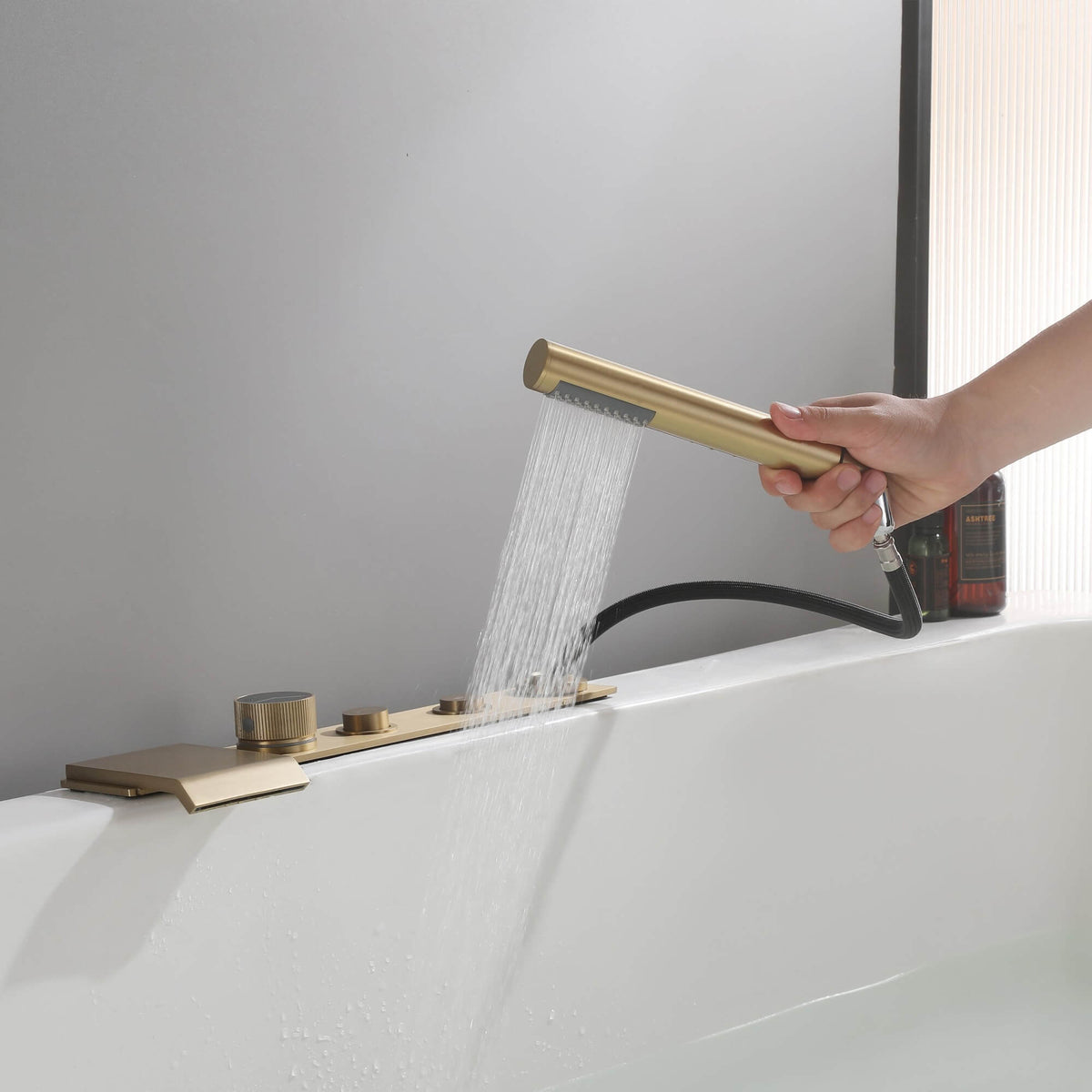 Flat Waterfall Deck-Mounted Bathtub Faucet with Textured Control Knobs and Hand Shower