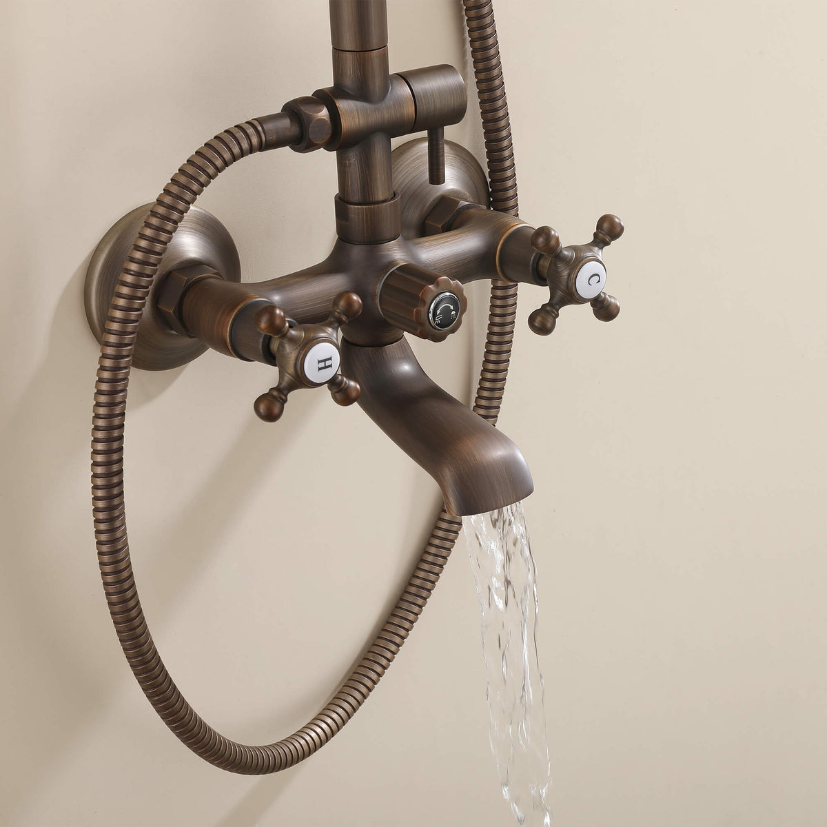 Water flowing from antique brass tub spout