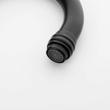 Black bathroom faucet aerator detail with water saving design