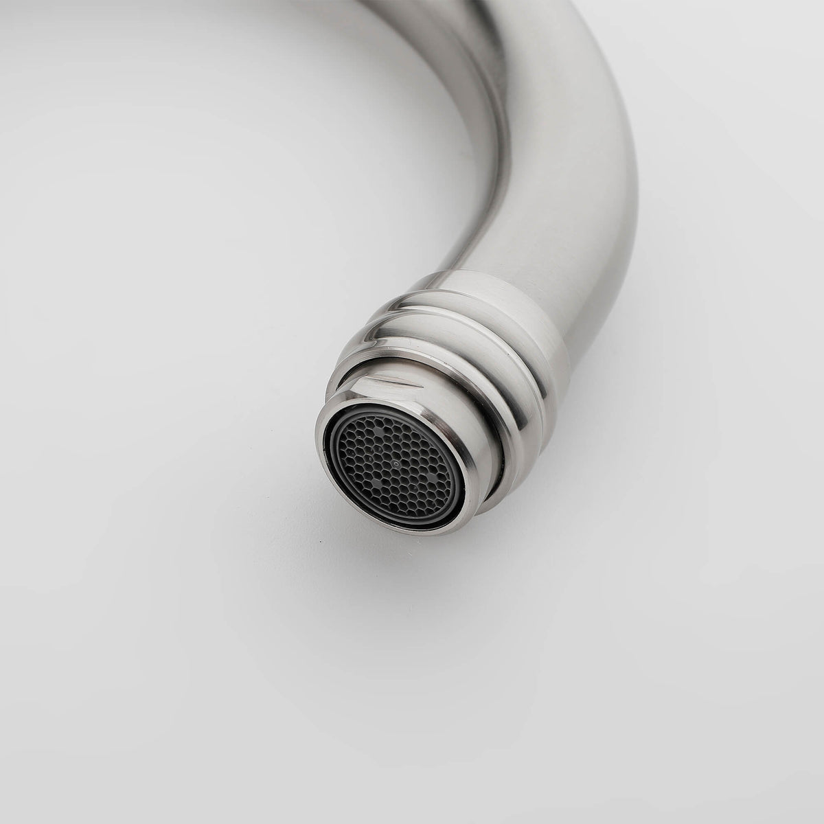 Brushed nickel bathroom faucet aerator detail for smooth water flow