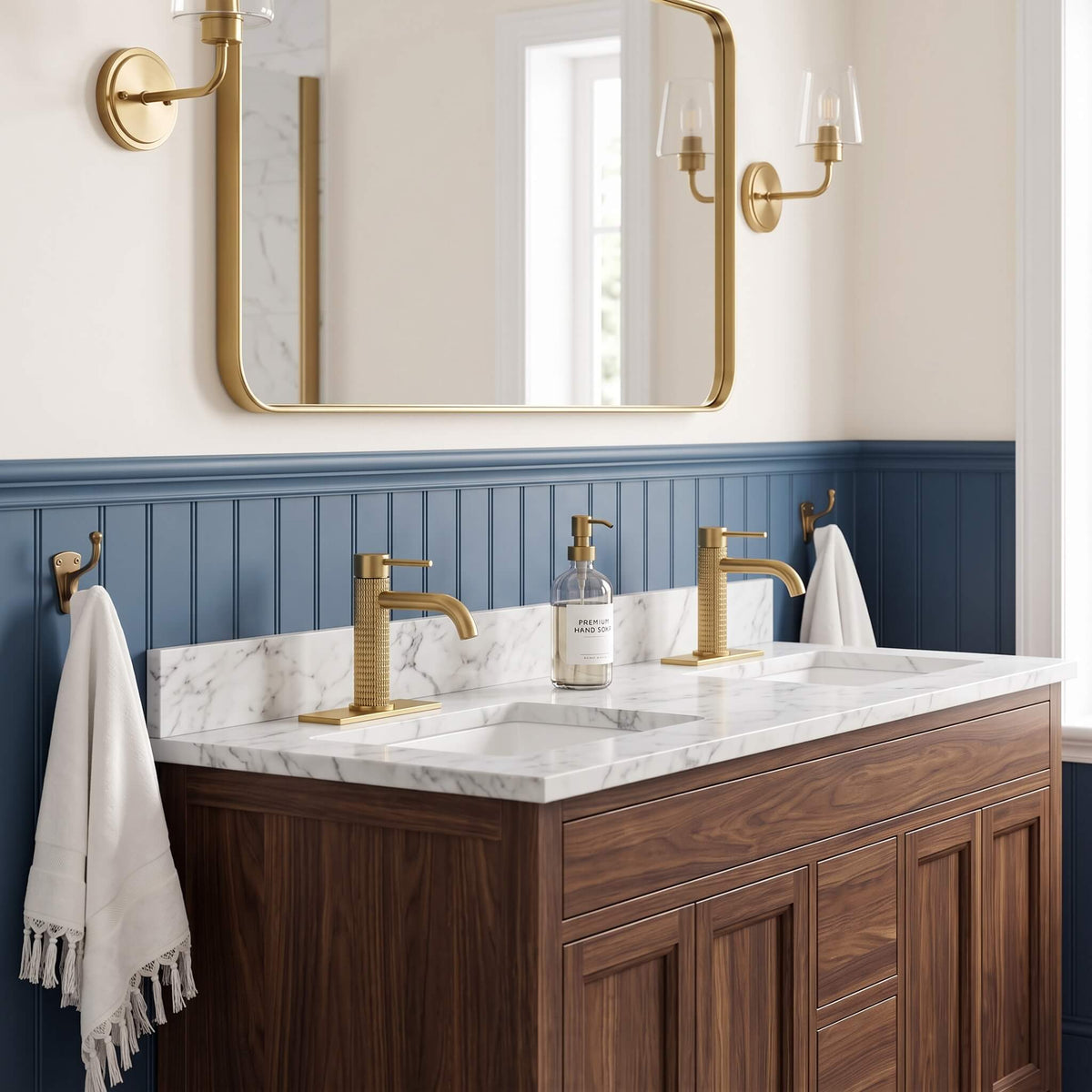 Brushed gold bathroom faucets installed on double vanity sink with luxury modern bathroom decor