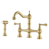 Brushed gold kitchen bridge faucet with two handles and matching side spray