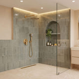 Brushed gold rain shower system with handheld shower and wall-mounted 10-inch rainfall shower head