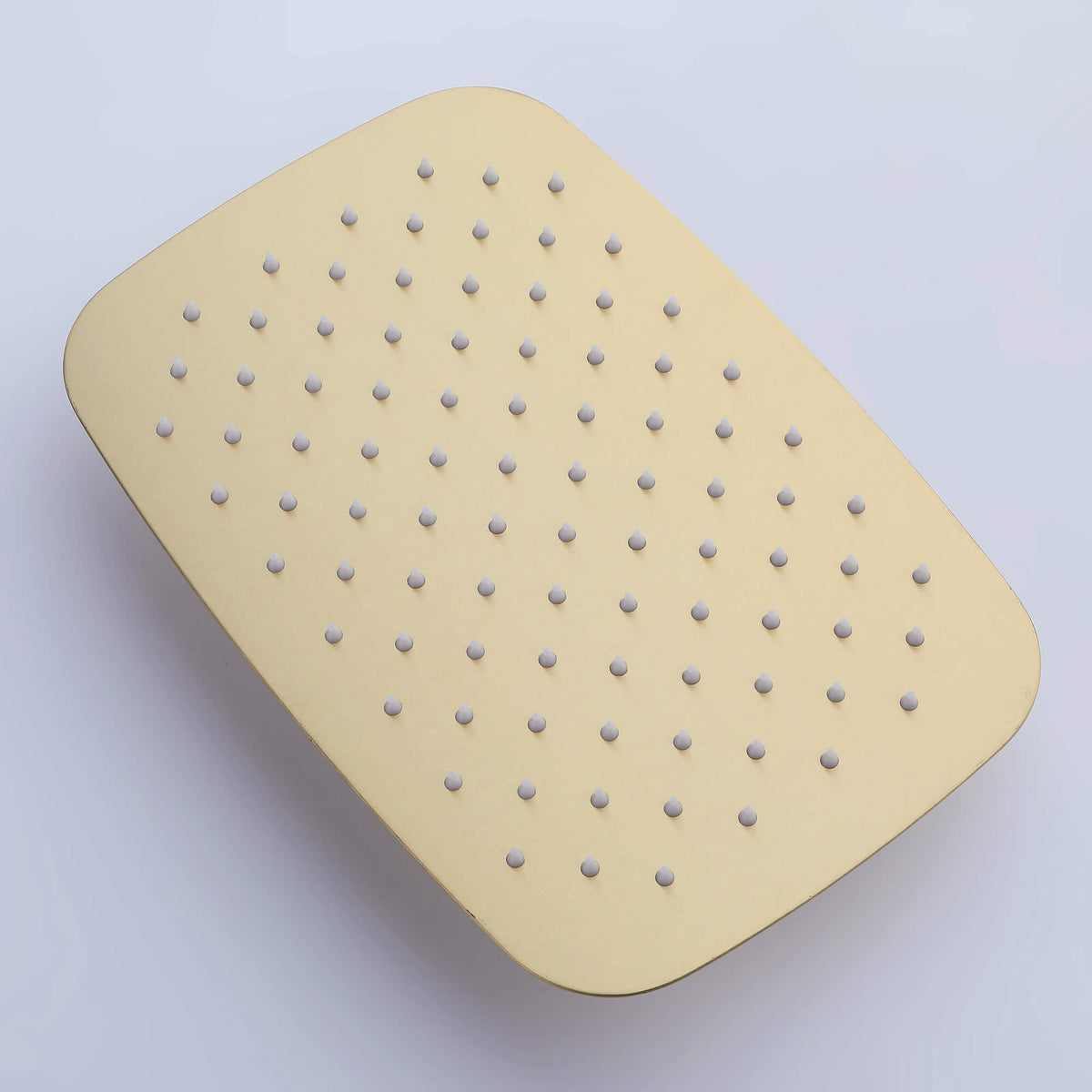 Rectangular brushed gold rainfall shower head front view with multiple silicone nozzles.