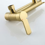 Close-up of single-handle control on a brushed gold wall-mounted tub faucet
