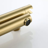 Close-up of the aerator on a brushed gold wall-mounted bathtub faucet spout