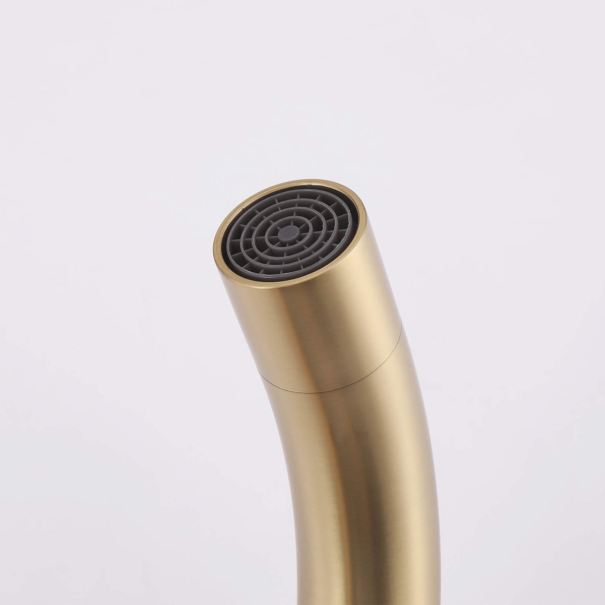 Close-up of brushed gold floor mount tub filler spout with aerator
