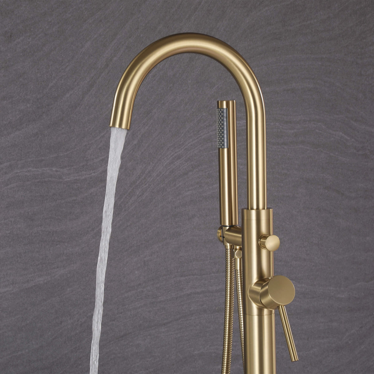 Brushed gold tub filler with handheld shower and curved bathtub spout