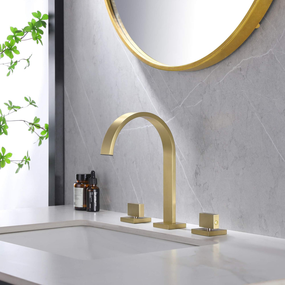Brushed gold waterfall bathroom faucet installed on modern vanity sink countertop