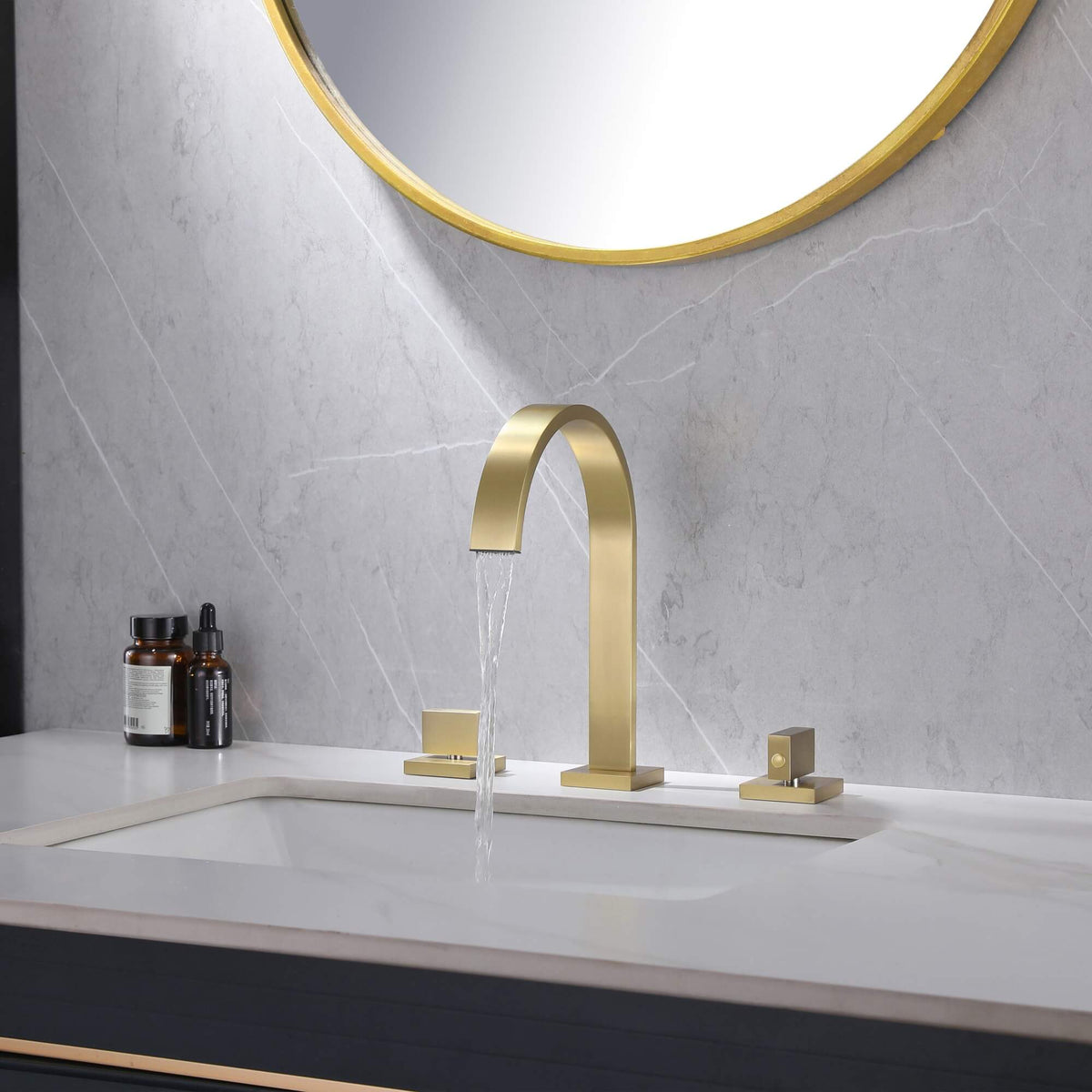 Brushed gold waterfall faucet with smooth water flow on bathroom sink