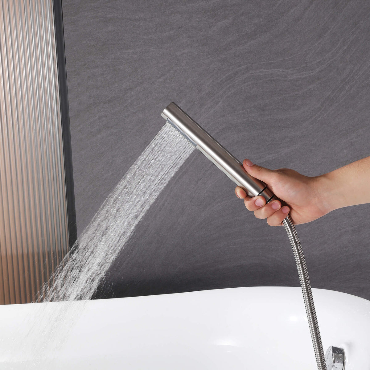 Brushed nickel handheld shower for freestanding tub filler with flowing water