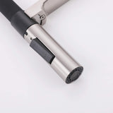 Close-up of brushed nickel pull-down sprayer nozzle with black mode switch
