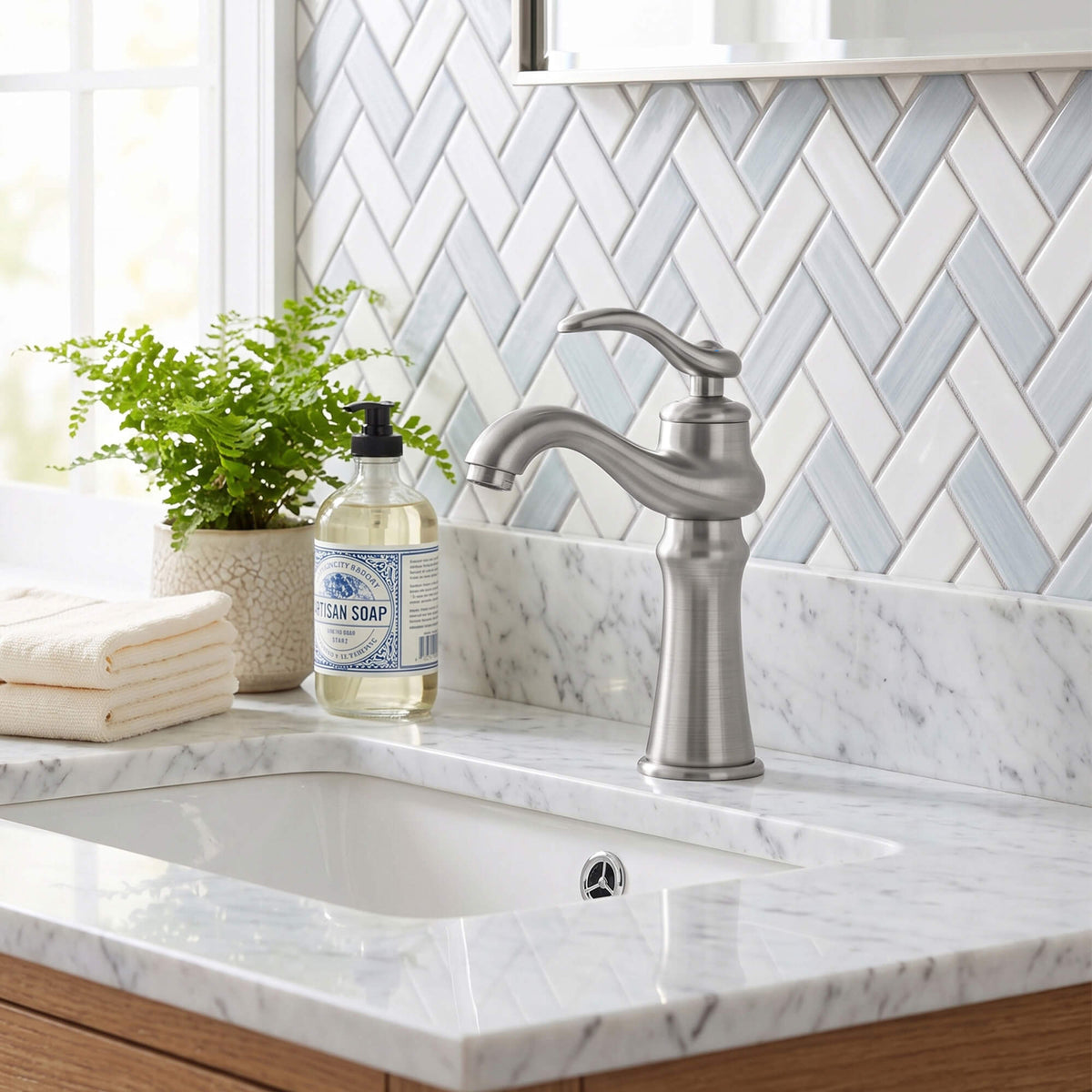 Brushed nickel single handle bathroom faucet with elegant curved design