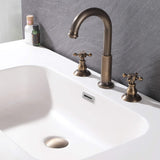 Classic cross handle sink faucet installed on a white bathroom basin