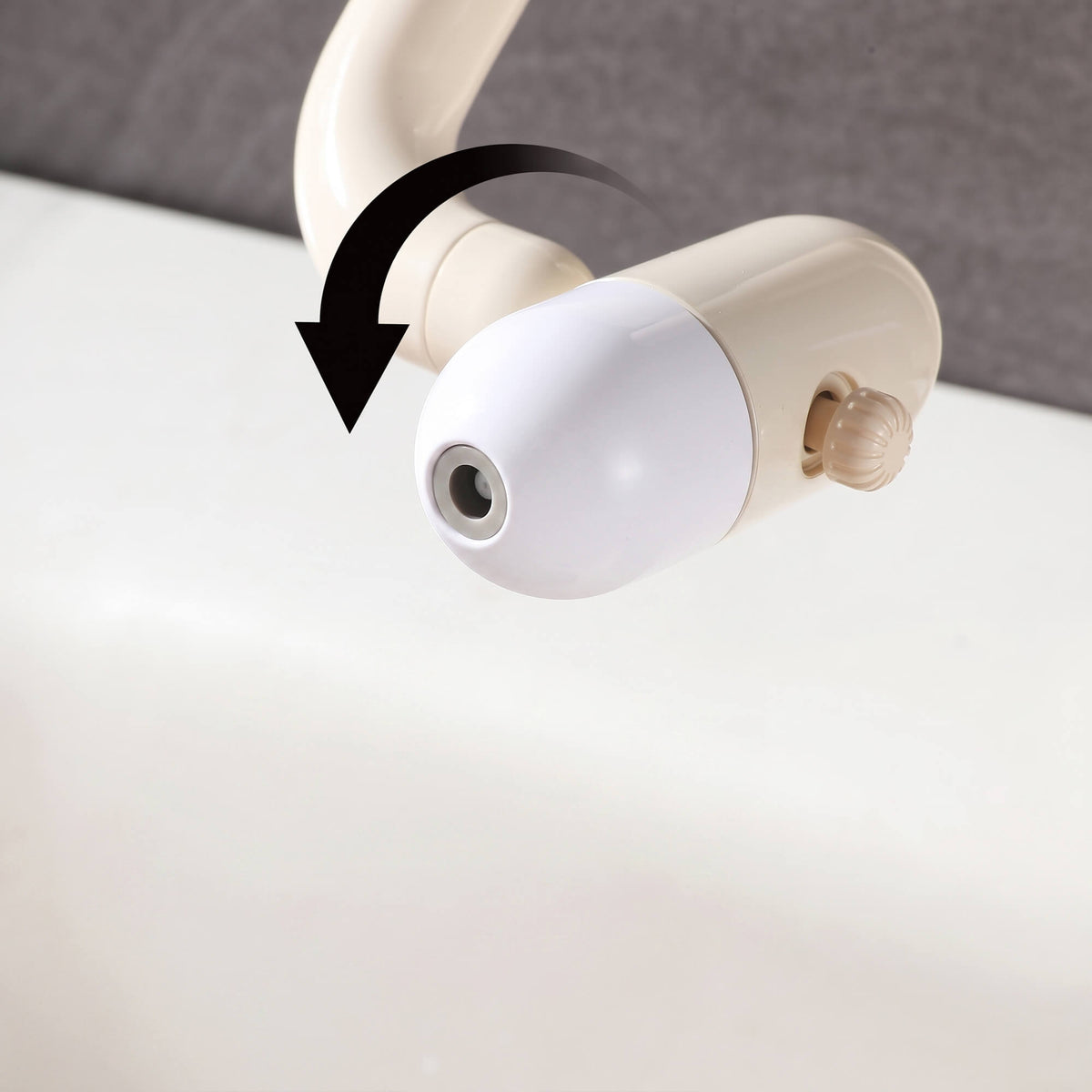 Cream white faucet head with rotating spray adjustment feature