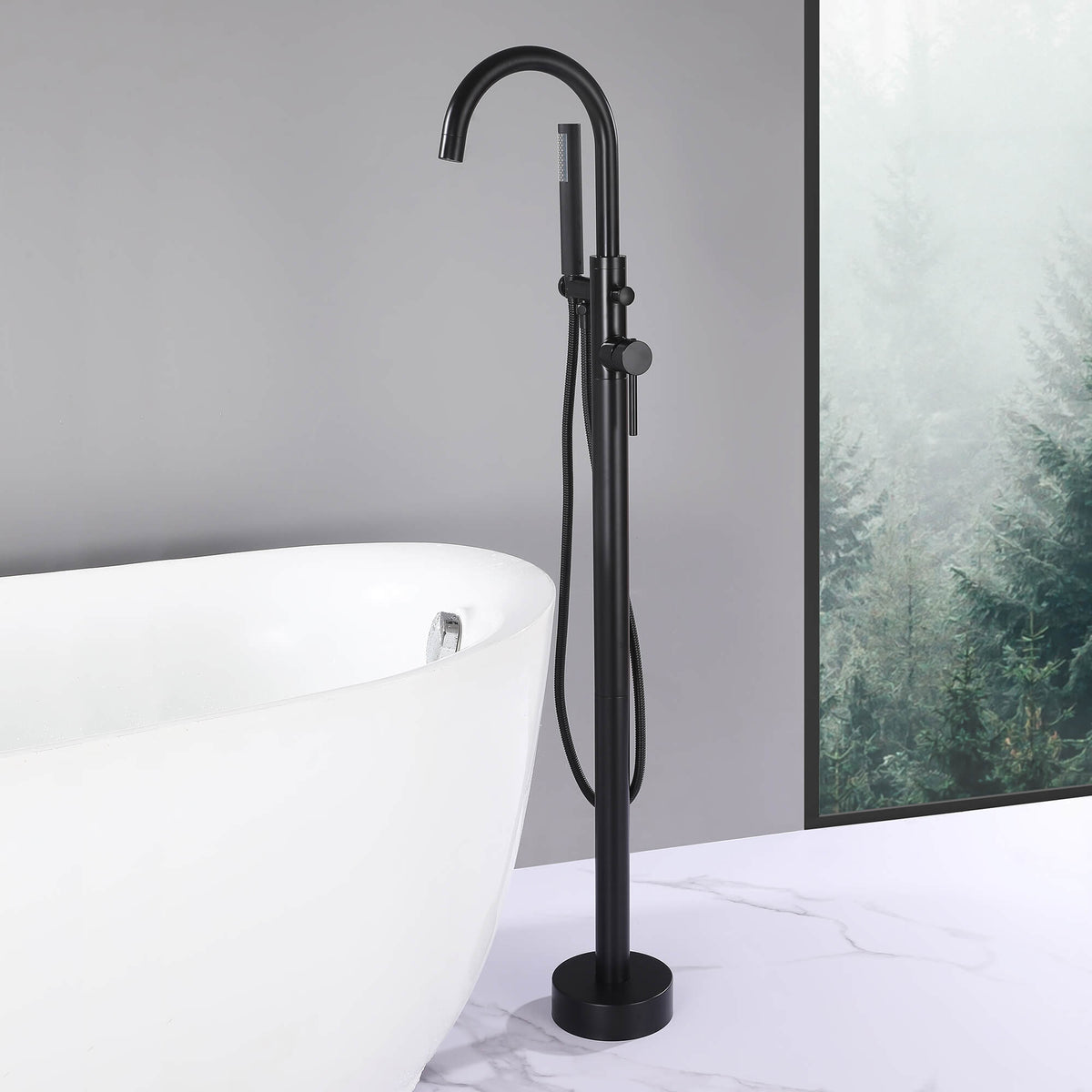 Matte black freestanding bathtub faucet with hand shower installed beside white soaking tub