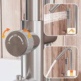 Close-up of freestanding tub faucet diverter control switching between spout and handheld shower
