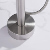 Close-up of round floor mounting base on brushed nickel freestanding tub filler