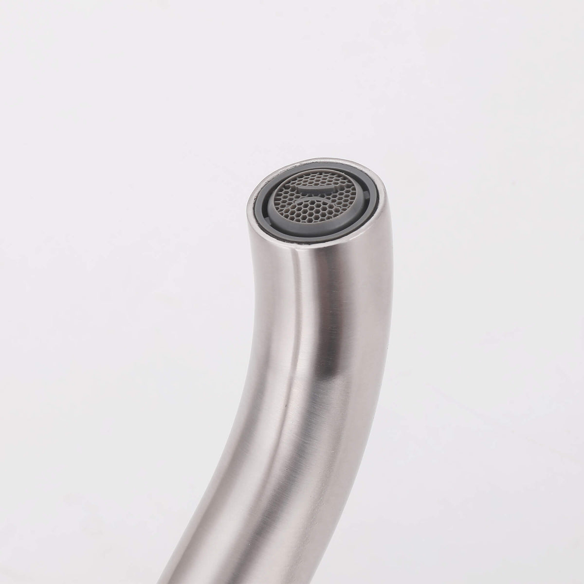Close-up of curved freestanding tub filler spout with built-in aerator
