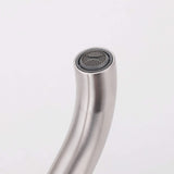 Close-up of curved freestanding tub filler spout with built-in aerator