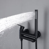Matte black handheld shower spraying water beside the wall-mounted tub faucet