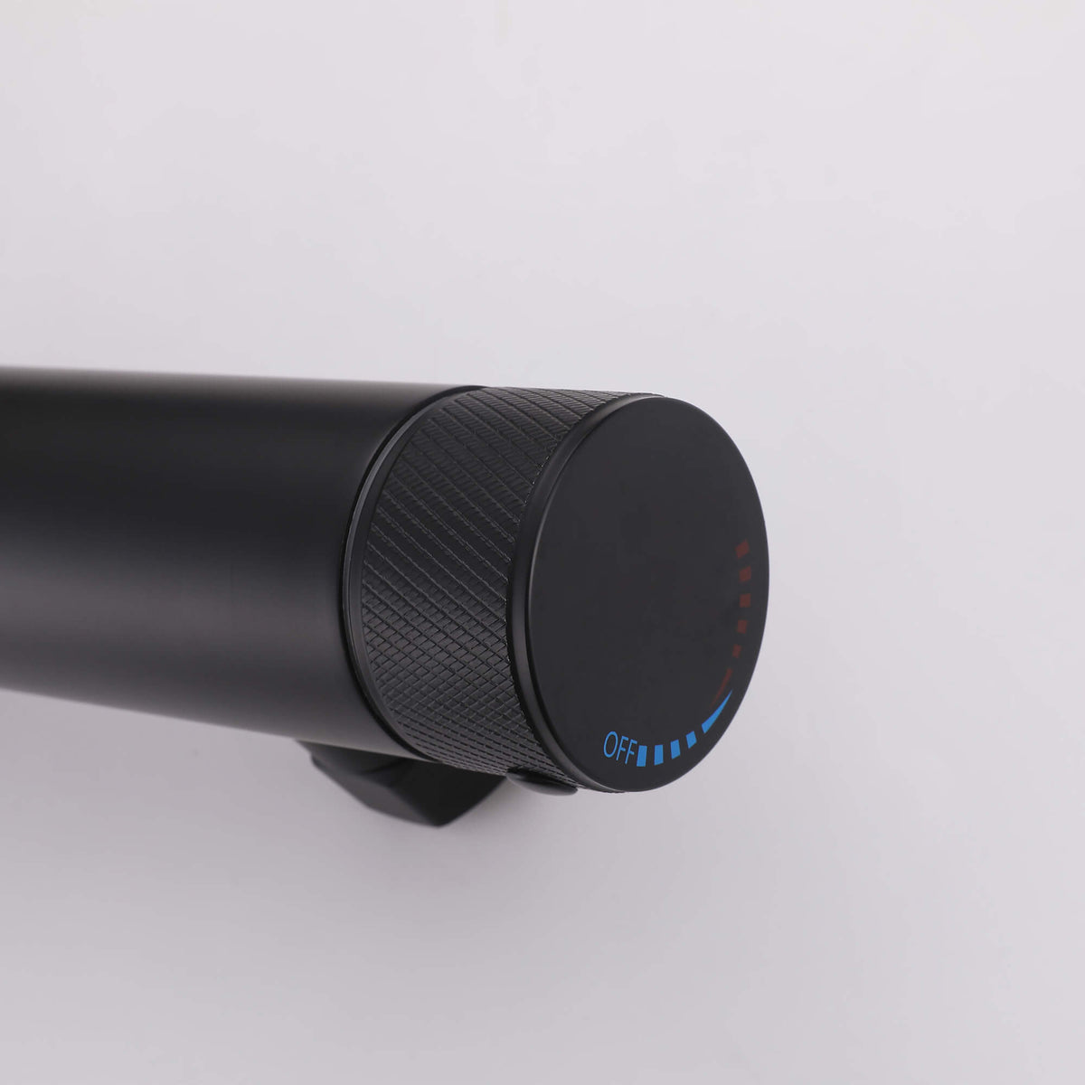 Outdoor shower temperature control handle detail with modern black finish