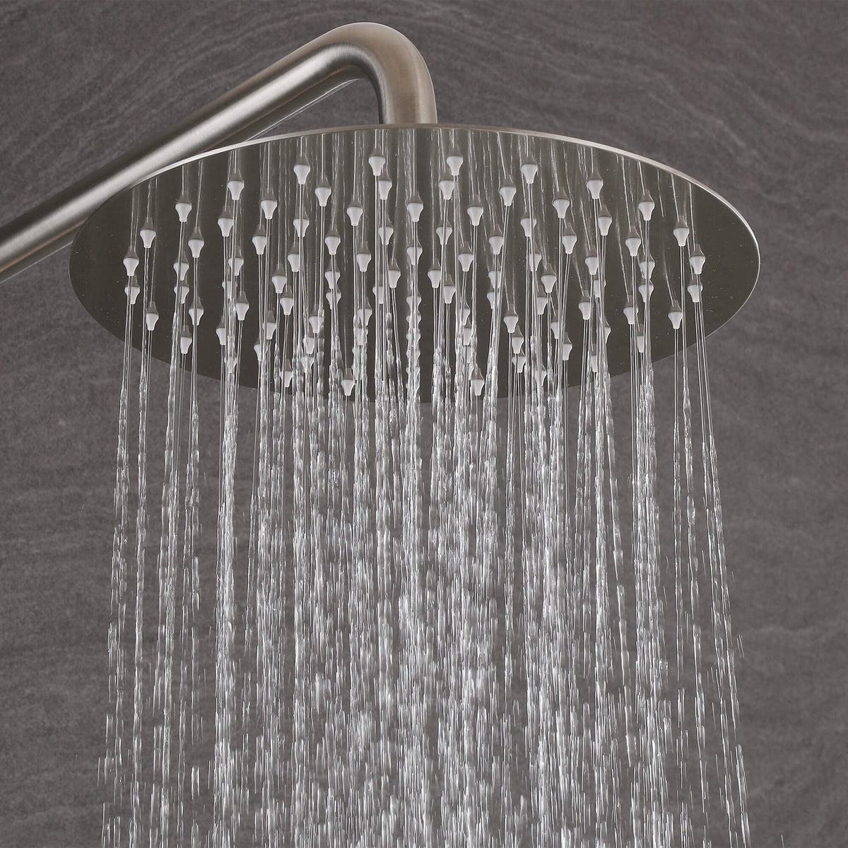 Round rainfall shower head delivering a steady water spray on the JK0561 brushed nickel outdoor shower system.