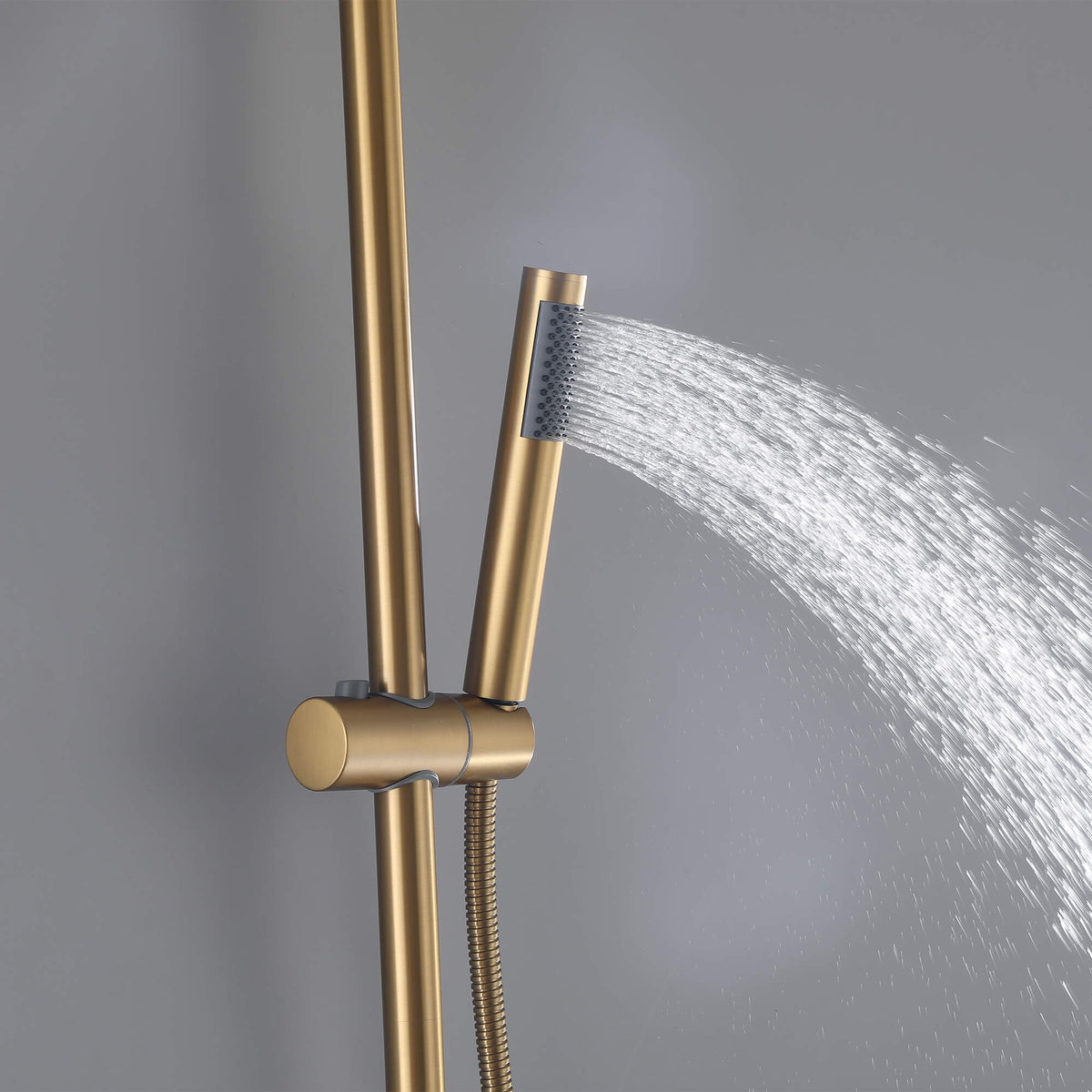 Handheld shower sprayer delivering a steady water spray on the brushed gold JK0563 wall mounted outdoor shower system.