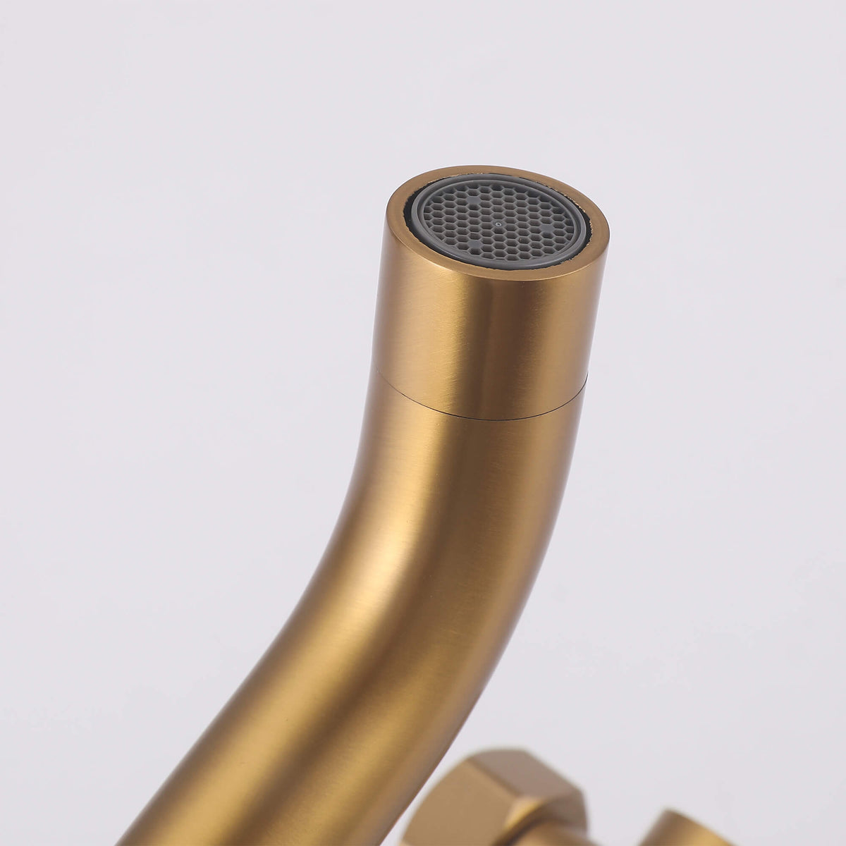 Close-up of the brushed gold tub spout outlet and aerator on the JK0563 wall mounted outdoor shower system.