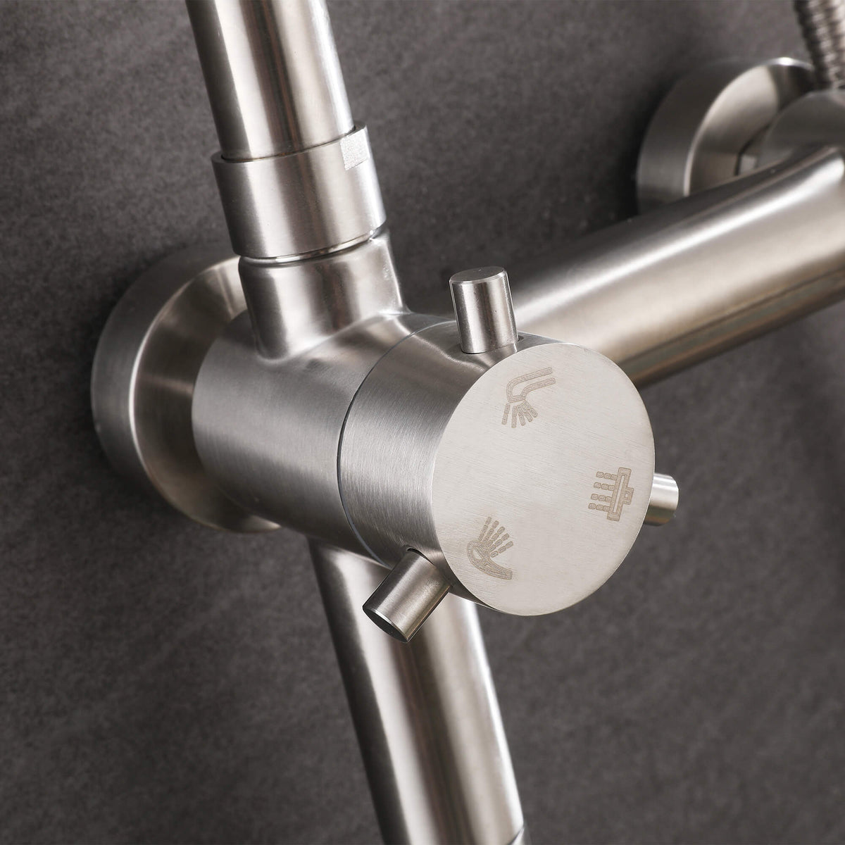 Close-up of the JK0564 316 stainless steel shower diverter with engraved function icons and a brushed nickel finish.