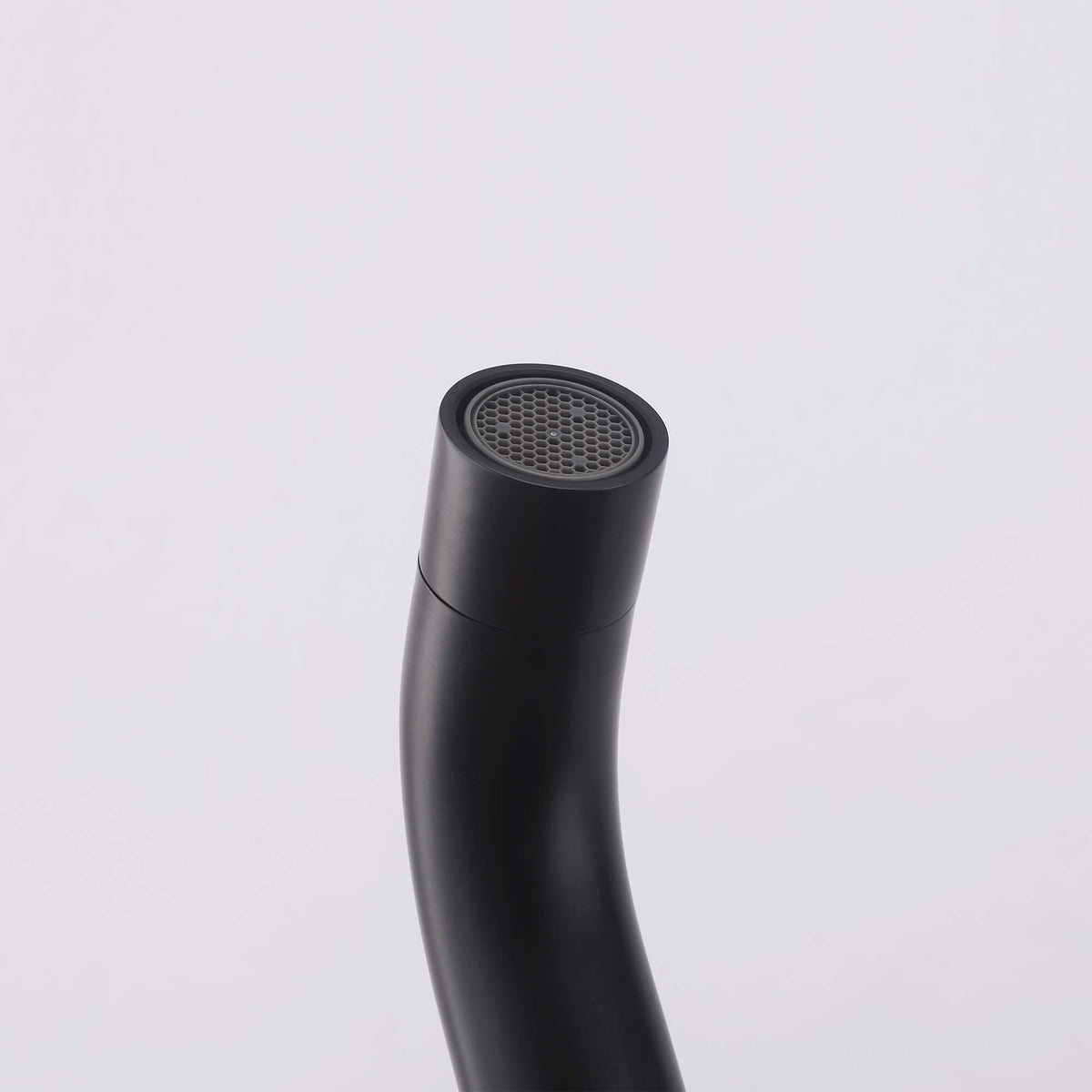 Close-up of the matte black tub spout outlet and aerator on the JK0565 outdoor shower system.