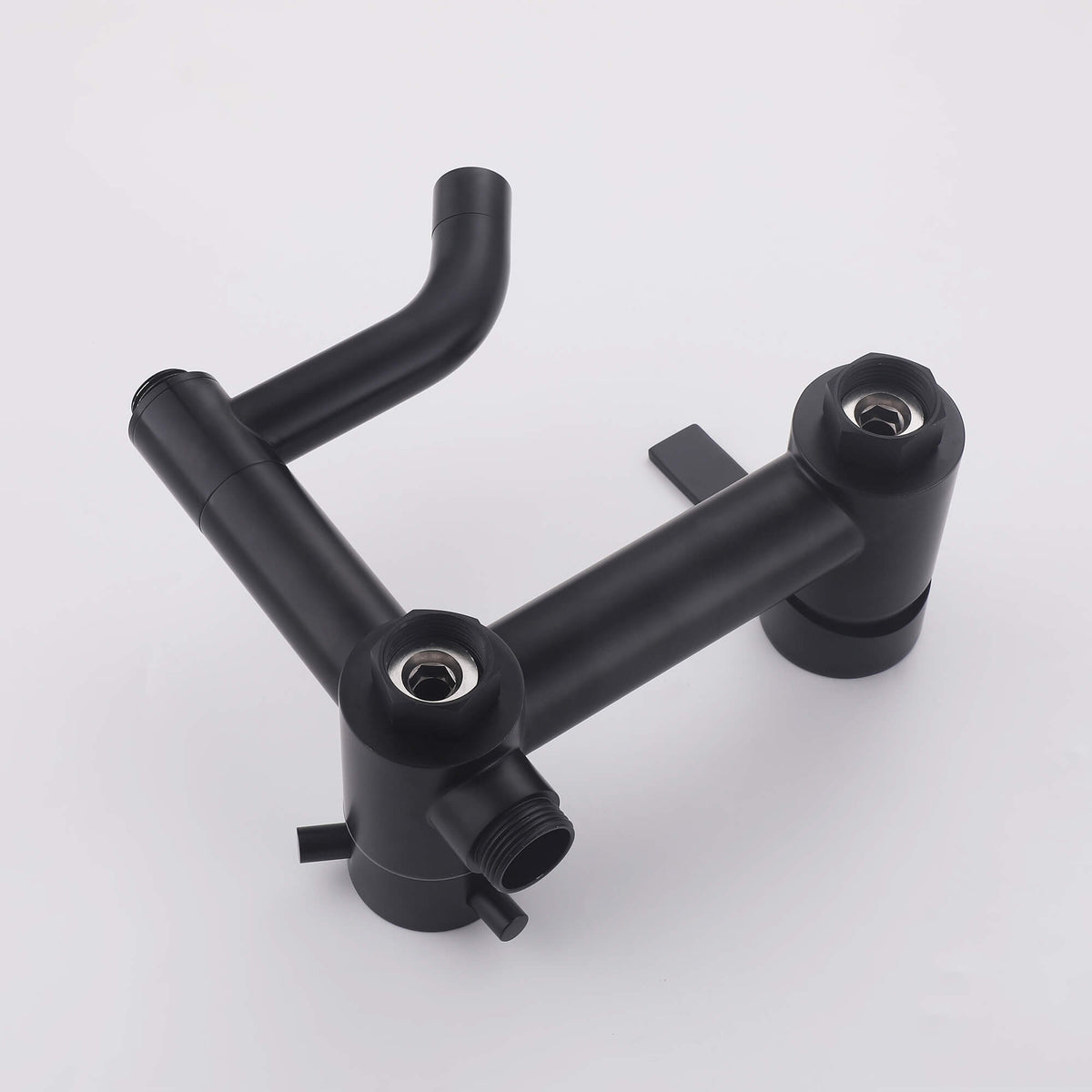 Close-up of the JK0565 matte black shower mixer body showing the threaded water connections and integrated tub spout assembly.
