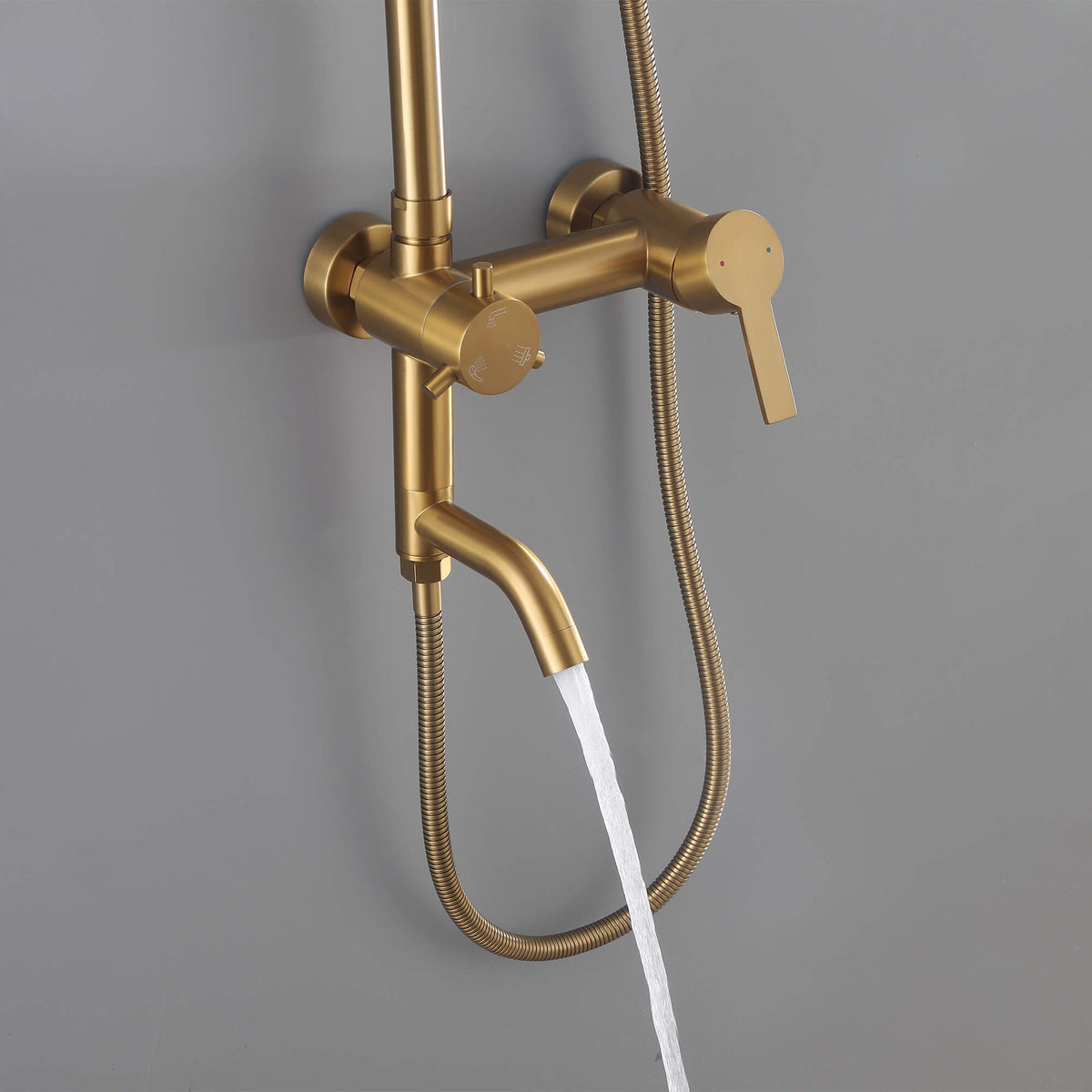 JK0566 brushed gold outdoor shower system with water flowing from the curved tub spout