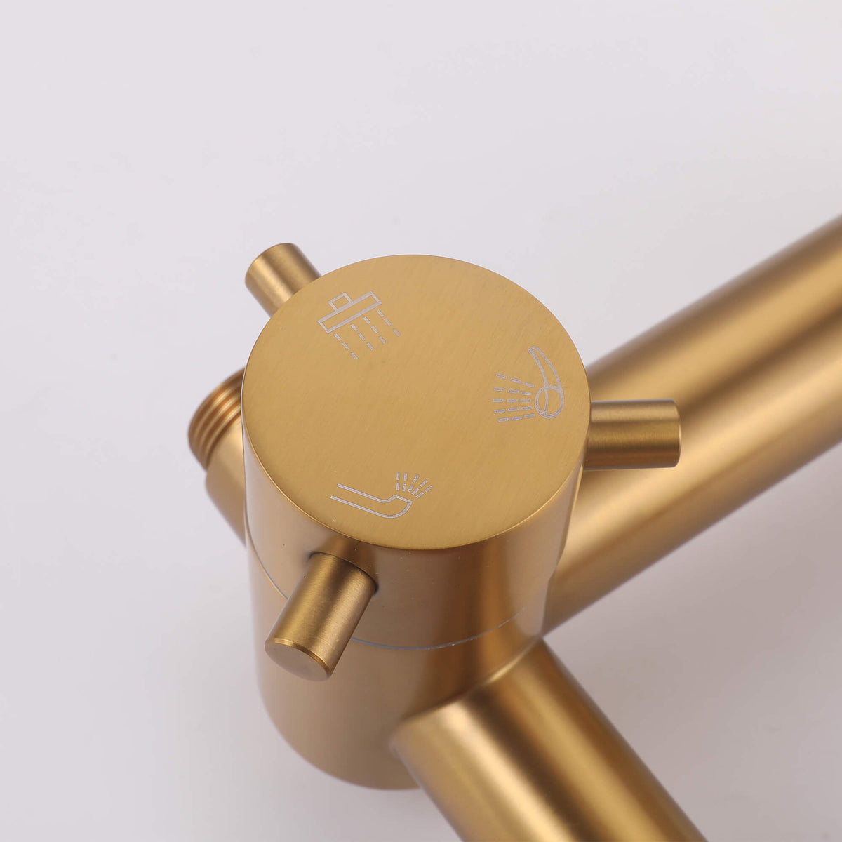Close-up of the JK0566 brushed gold shower diverter control with engraved shower function icons