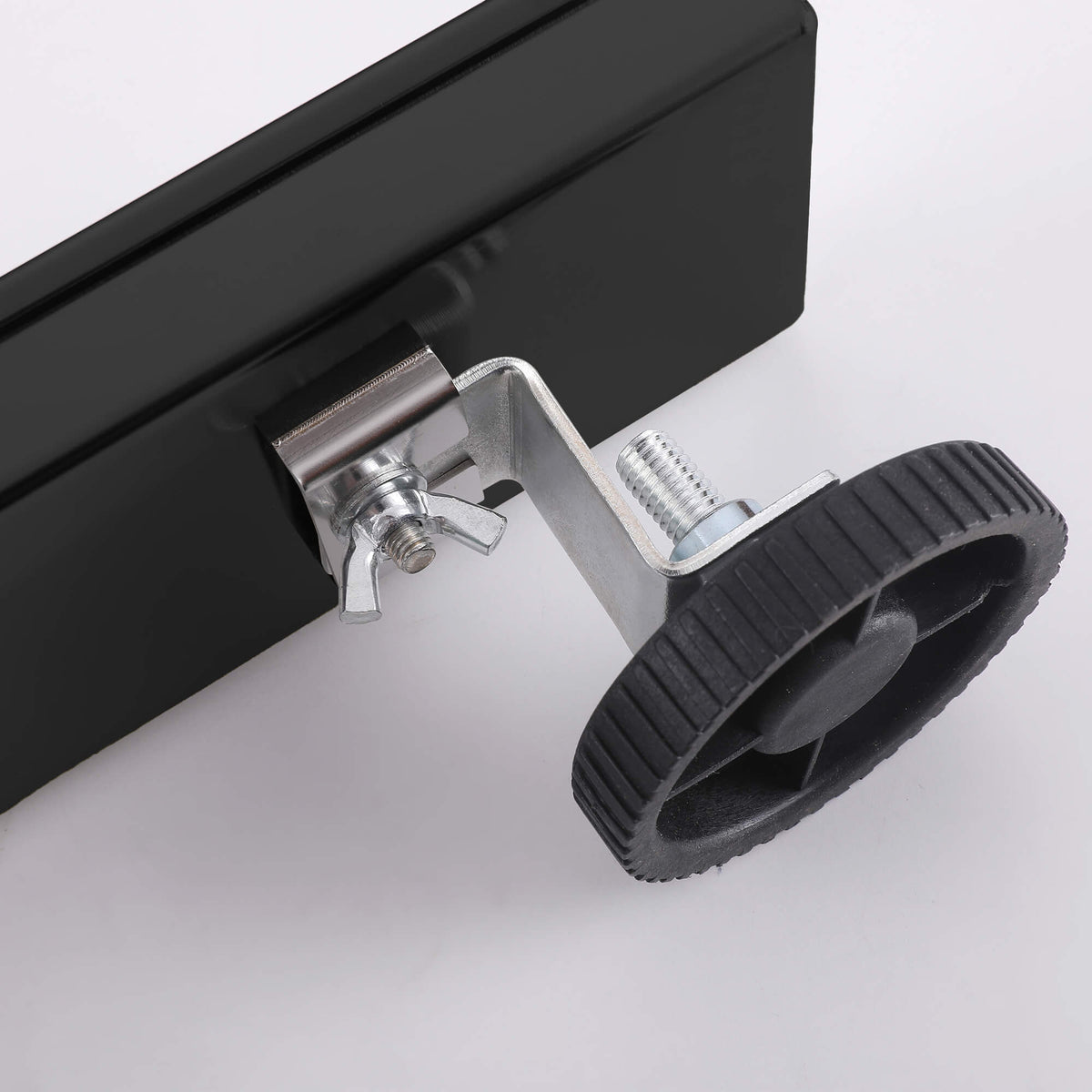 Matte black linear shower drain adjustable leveling feet detail