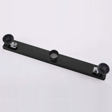 Matte black linear shower drain backside with adjustable leveling feet