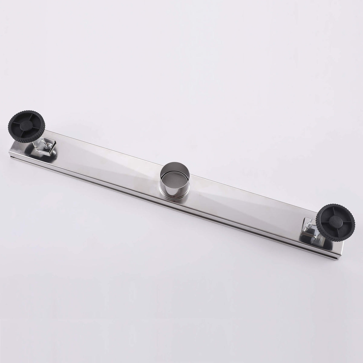 Stainless steel linear shower drain backside with adjustable leveling feet