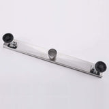 Stainless steel linear shower drain backside with adjustable leveling feet
