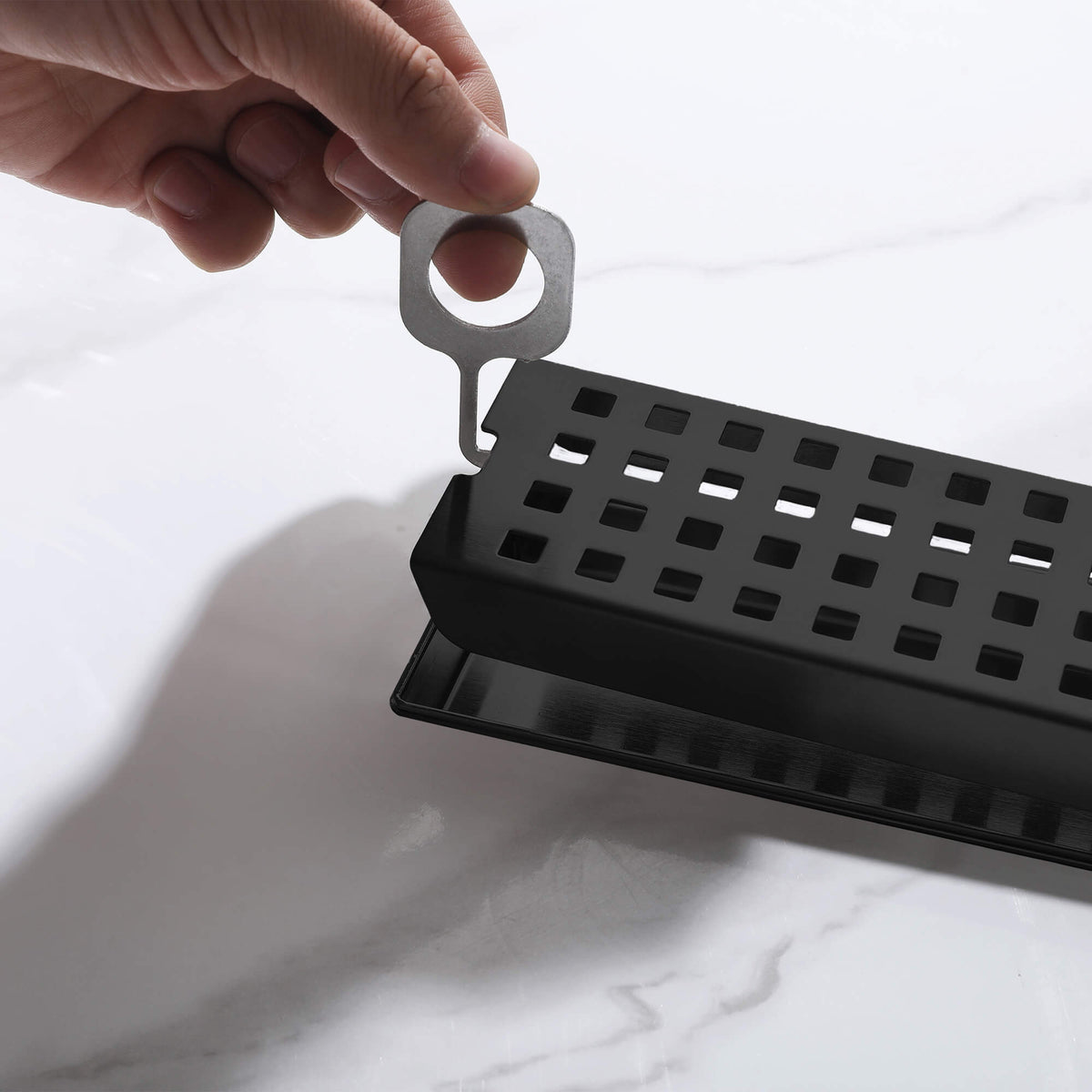 Matte black linear shower drain removable grate with lifting key
