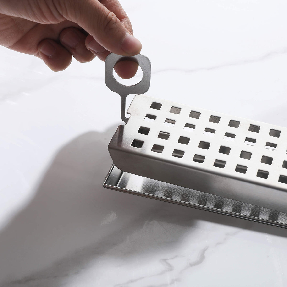 Stainless steel linear shower drain removable grate with lifting key