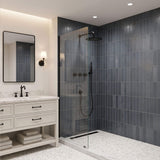 Matte black shower system installed in a modern bathroom with rainfall shower head and handheld shower